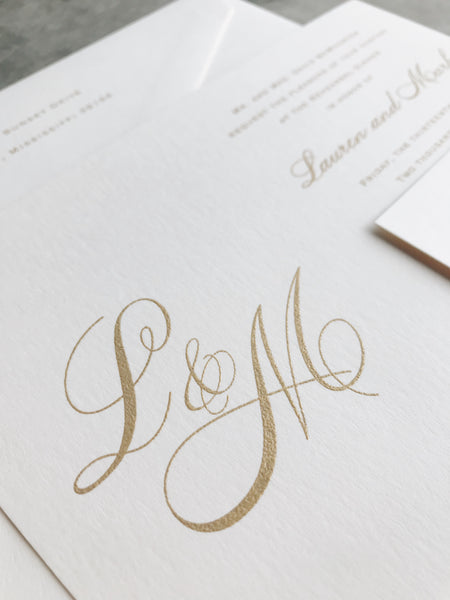 gold-monogram-script-wedding-invitation-classy
