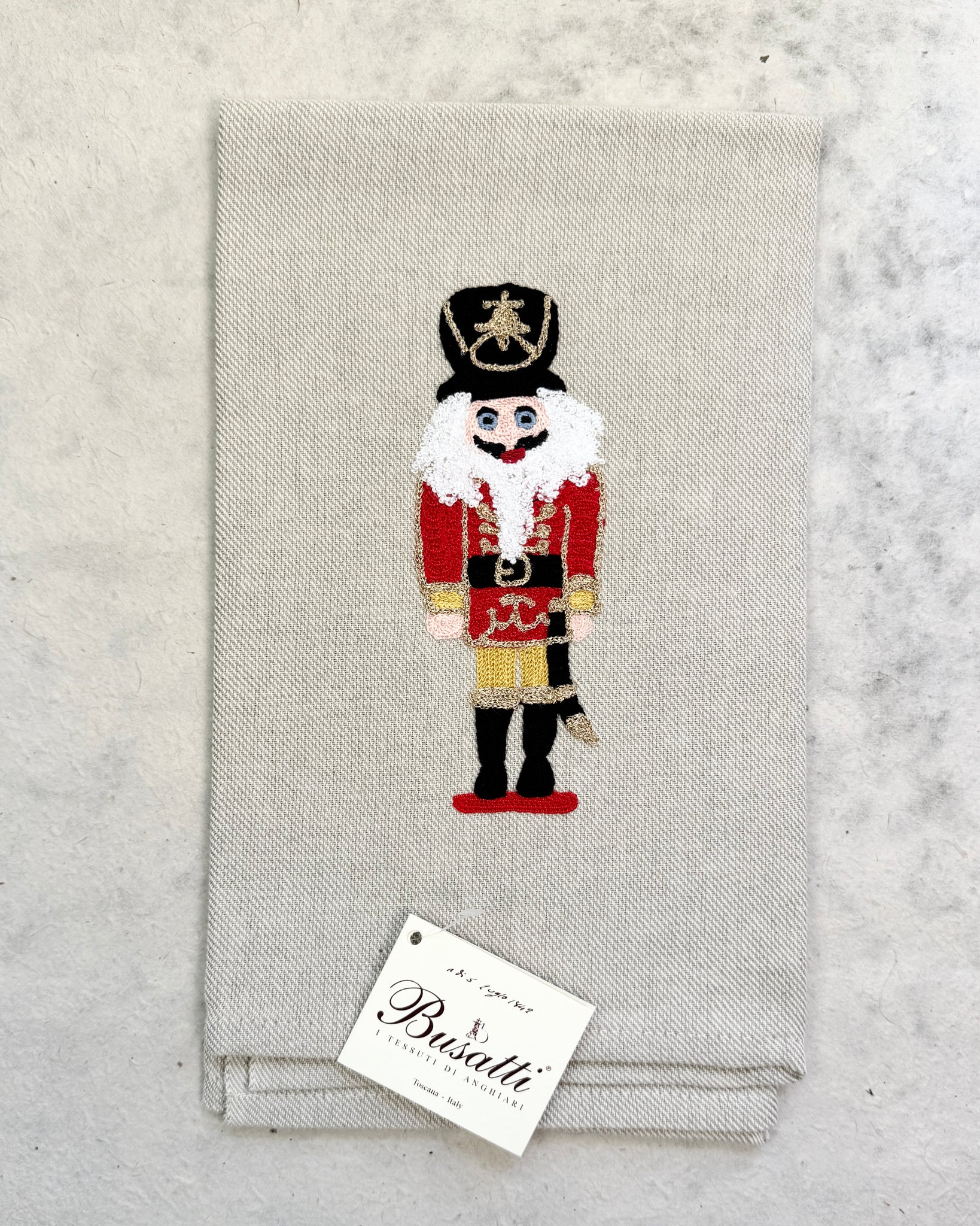 Nutcracker on Taupe Due Olive Kitchen Towel (COL.37 EMBR.SCHIACCIANOCI2020)