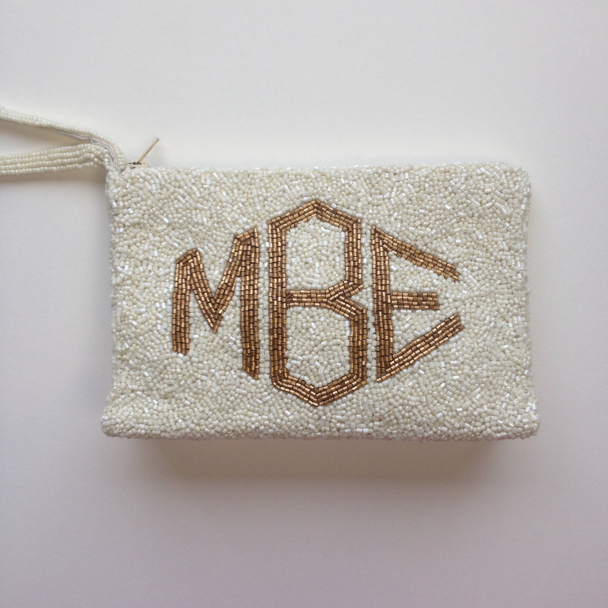 Monogram top beaded clutch